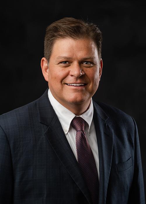 Headshot of Eric Moyen smiling toward the camera.