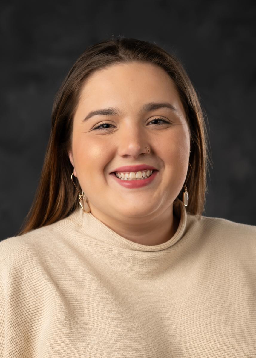 Headshot of Jenna Schmidt smiling toward the camera.